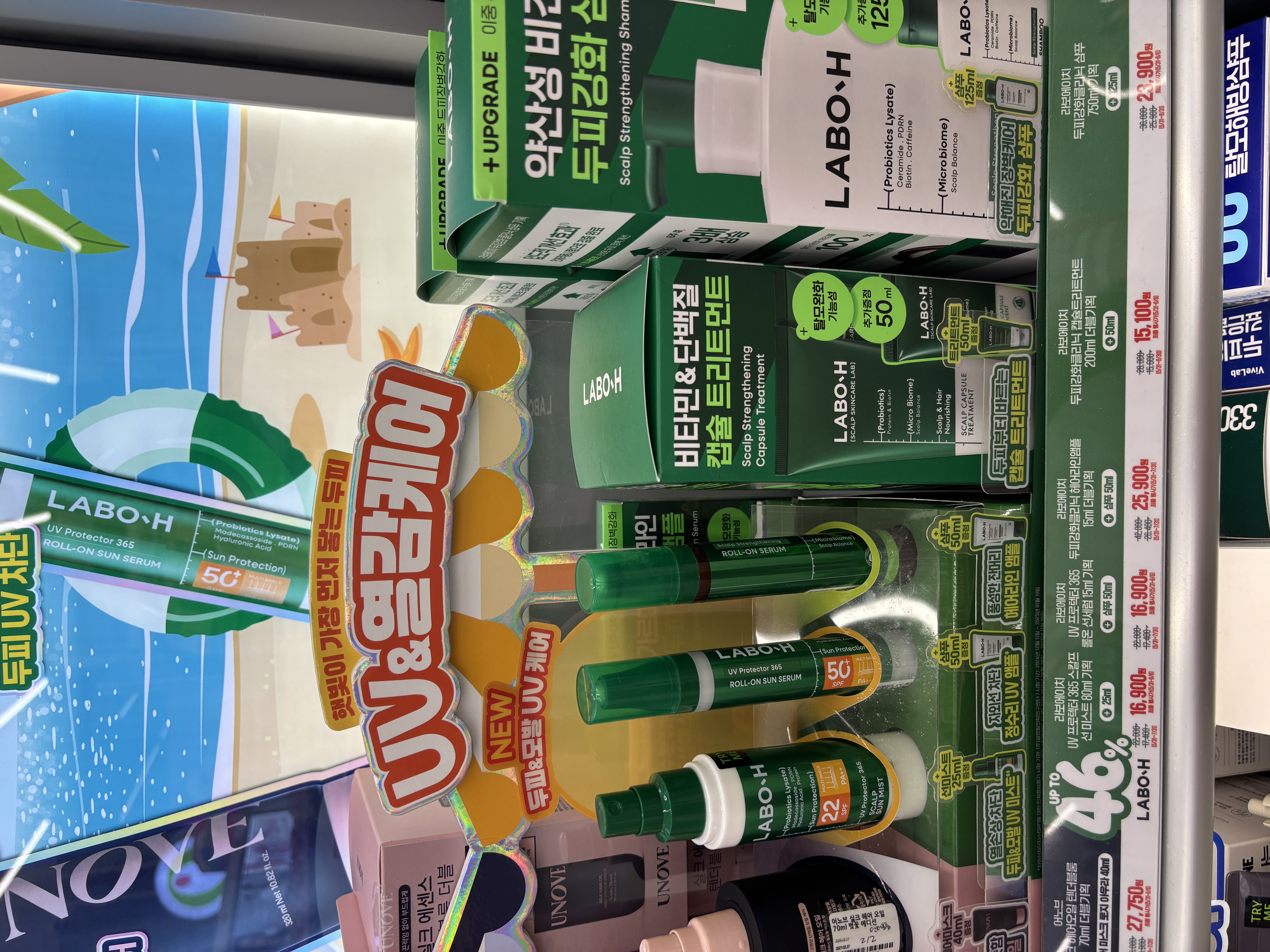 LABO-H UV Protector 365 Roll-On Sun Serum SPF 50 plus displayed at Olive Young with UV and scalp care promotional signage and 46 percent off discount