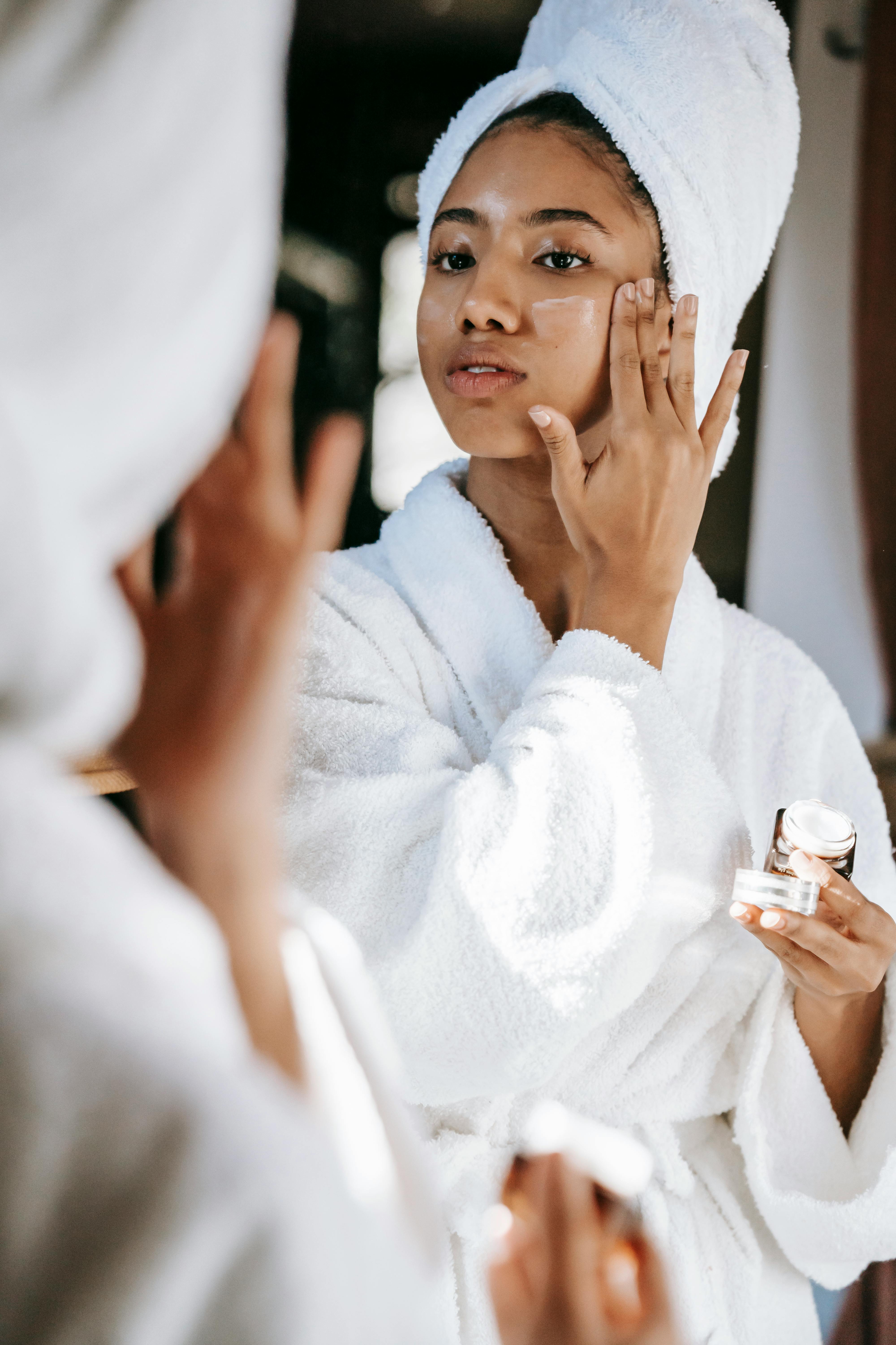 Close-up of dewy, luminous glass skin showing a smooth even complexion with a soft natural glow